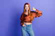 Photo of pretty young woman demonstrate thumb up wear brown shirt isolated on violet color background