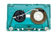 Turntable arm on old blue audio cassette tape open