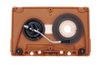 Turntable arm on old brown audio cassette tape open