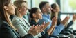 © gunzexx png and bg - A group of professionals engaging in applause, perhaps at a corporate event or seminar, signaling approval or celebration