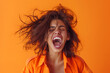 © 수동 김 - Portrait of an excited woman with an open mouth and messy hair screaming, isolated on an orange background, in the style of photo realistic photography