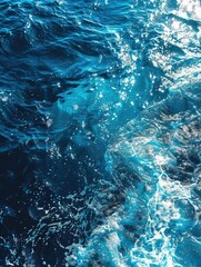 Wall Mural - the image is of a body of water with a lot of bubbles and foam