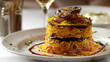 Exquisite plating of iranian saffron rice with grilled eggplant, elegantly arranged on a white dish, and adorned with fresh herbs