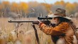 © liliyabatyrova - A woman is holding a rifle and wearing a hat while standing in a field
