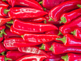 Fototapeta Big Ben - Red hot chilli peppers for sale at the local market. Colorful, natural pattern top view closeup.