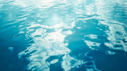 Wall Mural - clear blue sea water surface with light reflections texture