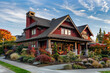 © Naveed Arts - A luxurious deep ruby red craftsman cottage style home, featuring a triple pitched roof, exquisite landscaping, a direct sidewalk, and superior curb appeal, embodying upscale living.