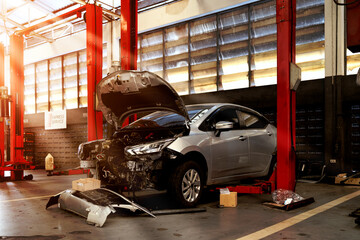 Wall Mural - car repair station with soft-focus and over light in the background