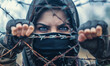 woman behind Barbed Wire on the run, freedom and asylum concept
