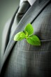 © id512 - businessman with a green plant in his suit pocket, eco friendly business concept