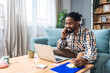 © Srdjan - Career winner mindset. Young freelance businessman working at home. Confident dedicated male learning and educate himself for better opportunity in her business career, work on laptop computer.