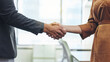 © peopleimages.com - Handshake, agreement and deal with business people in office for meeting, contract and opportunity. Partnership, job promotion and teamwork with employee shaking hands for welcome, hello and b2b