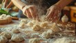 Close up of female hands kneading dumplings on the table