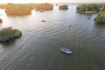 Canvas Print - Tourist boat between islands