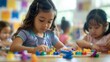 © Emiliia - A group of children engaged in play at a table with various toys scattered around them.