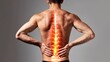Lower back pain. Young man suffering from lower back pain with specific area with inflammation