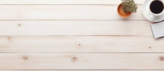 Leinwandbilder - The top down view of a white wooden office desk with equipment for working accompanied by a cup of black coffee and a blank board for your message in a flat and minimalistic style A perfect copy spac