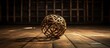 An aged Sepak Takraw or rattan ball rests on the floor seen up close through a cage There is room for additional content in the image