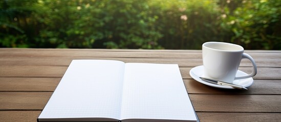 Fototapete - An isolated copy space image of a book diary and pen with blank pages on a white background