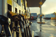 Gasoline stations advanced nozzles close-up, showcasing the duel with fuel prices in HD, a transport businesss bane 