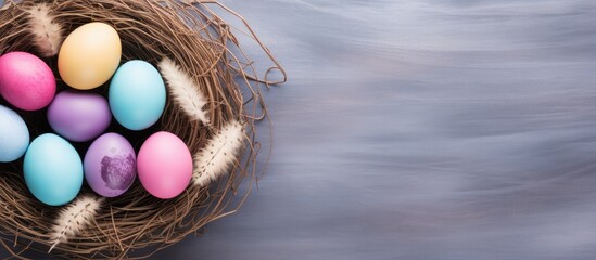 Poster - A trendy minimalist Easter themed flatlay with a top down perspective The image showcases colorful eggs and a nest portraying the essence of the spring season Ample copy space is available for adding