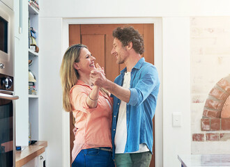 Poster - Mature, couple and happy with dancing in kitchen for bonding, romance or listening to music in home. People, holding hands and dancer in house for celebration, waltz together or enjoyment in marriage