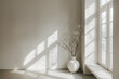 Minimalist white interior with a window casting long shadows, creating an elegant and tranquil atmosphere. A vase of dry branches adds texture to the scene. The room is well-lit by natural light.