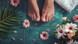 © alphaspirit - Beautiful spa day with elegant female feet and blossoms captured in a closeup, topdown view
