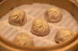 close up several soup buns (Tangbao) in steamer. Chinese dim sum food