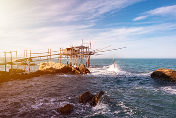 Wall Mural - Traditional wooden fishing house with a net near sea coast