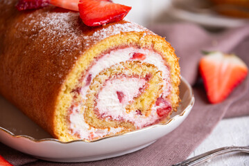 Wall Mural - Swiss roll with strawberries and cream, homemde dessert