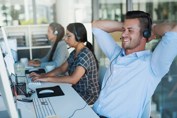 Poster - Call center, break and man at computer with customer service and crm work. Conversation, smile and phone consultant relax at a coworking office with headset and operator with web advice at desk