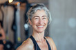 © Ekaterina Pokrovsky - Smiling mature woman in gym. Middle aged woman in fitness center.