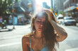 © Ekaterina Pokrovsky - Young woman suffering from extremely high temperature, heat stroke and dehydration on a street of a city. Heat waves, global warming and climate change concept.