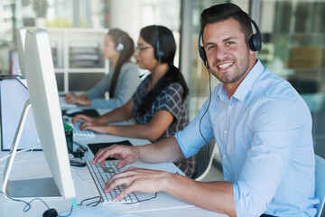 Poster - Call center, telemarketing and portrait of man at computer with customer service and crm. Conversation, smile and phone consultant at coworking office with headset and operator with advice at desk