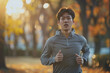 Male runner jogging in the park, active sport lifestyle