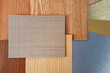 combination of various texture and colors of wooden veneer and stainless metallic samples isolated on background with clipping path. interior mood and tone board for selection.
