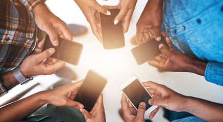 Wall Mural - cellphone, hands and group of friends in circle networking online for email, social media or interne