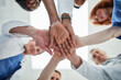 © peopleimages.com - People, hands together and below with medical team for meeting, unity or motivation at hospital. Low angle or closeup of group piling or touching in collaboration, solidarity or mission at clinic