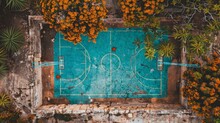   A Birds-eye Perspective Of A Basketball Court Encircled By Greenery And Flowers On A Stone Wall The Court Boasts A Blue Surface, Enclosed By Vibrant Orange