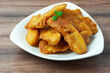 Close up of pisang goreng or banana fritters on a plate