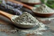 Heap of lavender powder in wooden spoons on rustic background