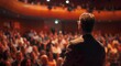 © BrightSpace - Banner, A man stands in front of a crowd of people, giving a speech. The audience is attentive and engaged, with many people looking at the speaker. The atmosphere is serious and focused