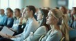 © BrightSpace - A group of people are sitting in a room and watching something,Professional seminar: diverse group attends conference for learning and collaboration. Banner captures dynamic corporate environment