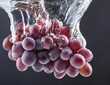 Red grapes fall into the water. Close up shot. Fruits and summer berries illustration