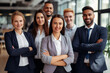 © Sajjad - Portrait of successful group of business people at modern office looking at camera. Portrait of happy businessmen and satisfied businesswomen standing as a team. Multiethnic group of people smiling