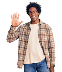 Wall Mural - handsome african american man with afro hair wearing casual clothes and glasses showing and pointing