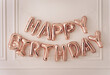 HAPPY BIRTHDAY. rose balloons. words made of inflatable balloons on white background