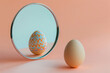 Raw egg in front of the mirror with reflection of Easter egg. AI generative art	