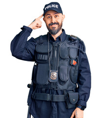 Sticker - Young handsome man wearing police uniform smiling pointing to head with one finger, great idea or thought, good memory